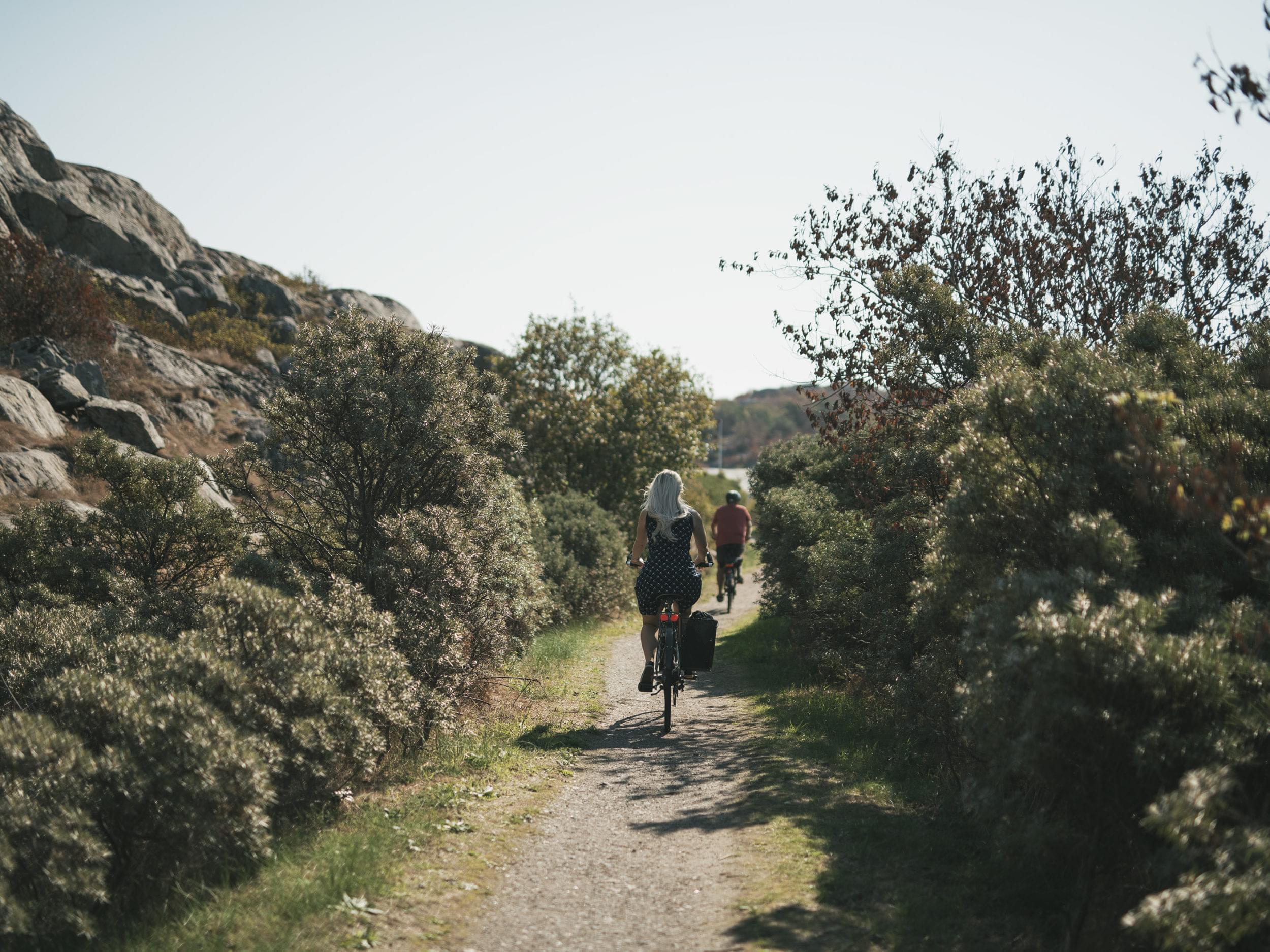 Bicycling couple on a path in Gothenburg archipelago