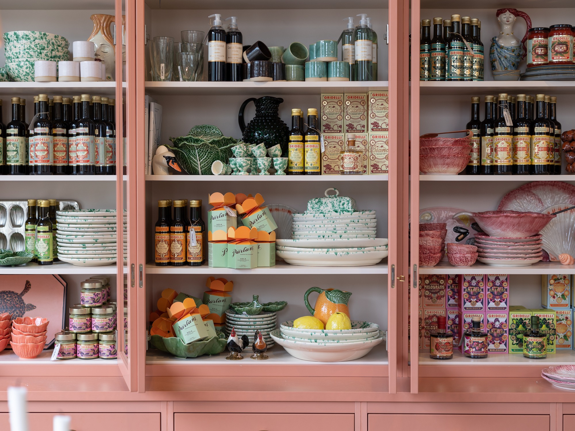 A cabinet with kitchen supplies at Artilleriet Kitchen.